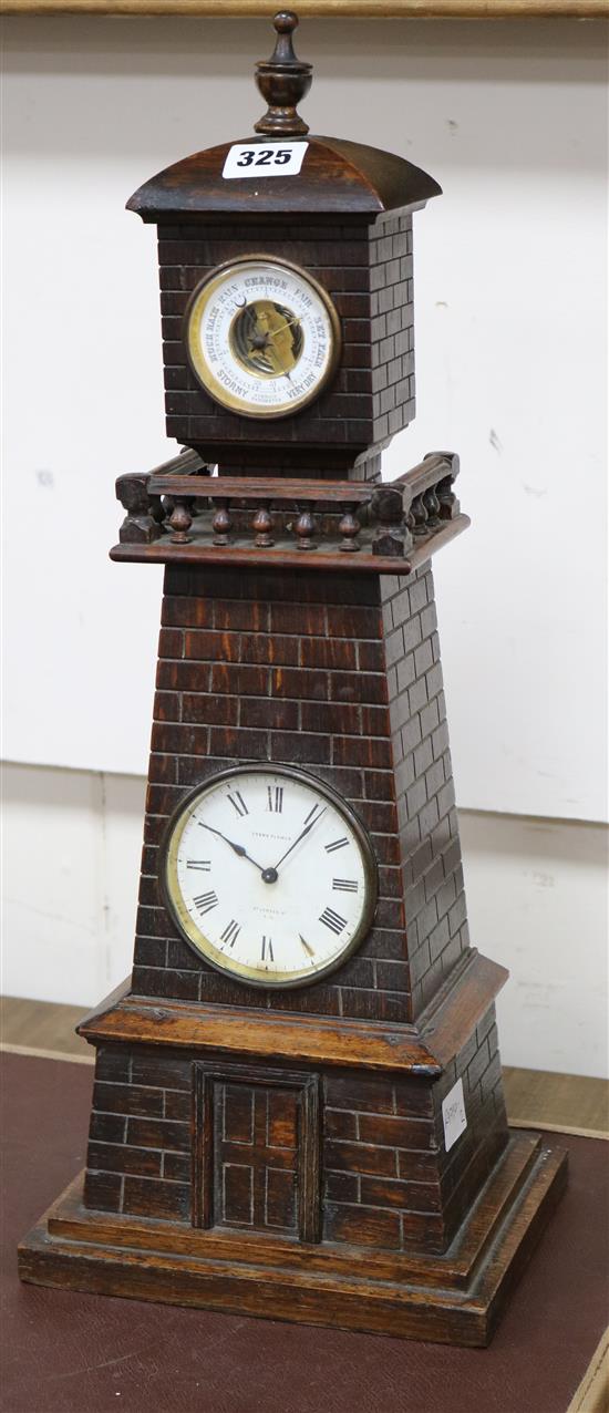 A late Victorian carved oak Lighthouse  clock barometer by Frank Flower of St James